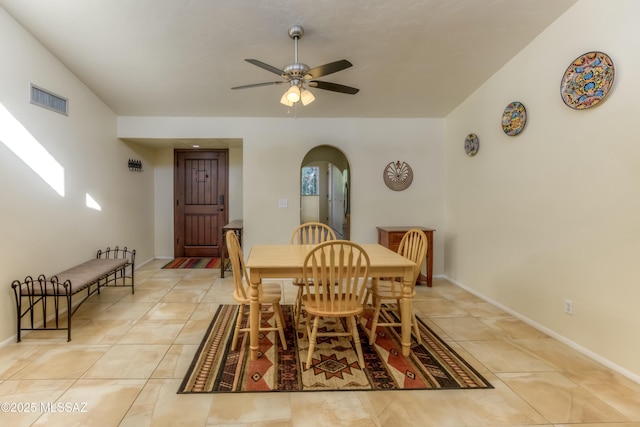 dining area with light tile patterned floors and ceiling fan