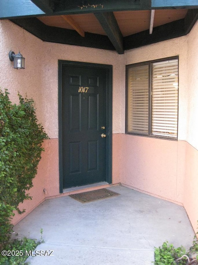 doorway to property featuring a patio