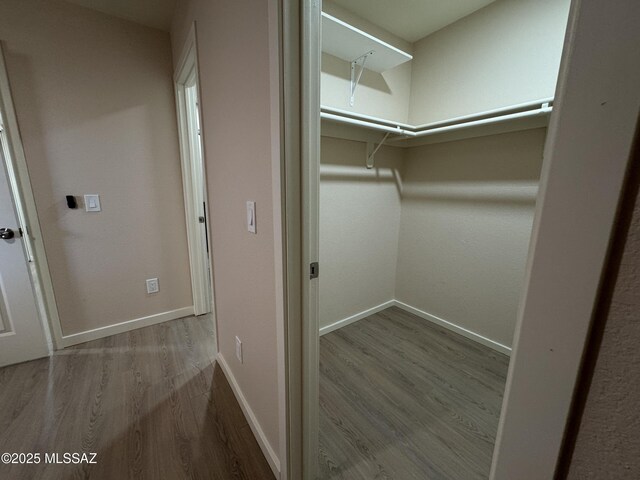 unfurnished room featuring french doors and light wood-type flooring