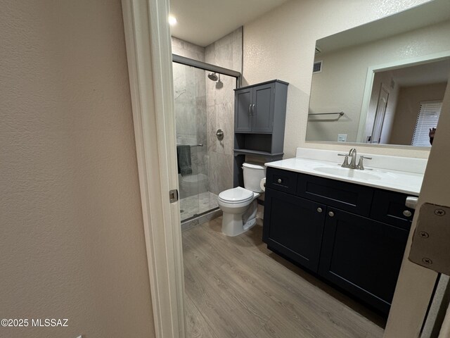 spare room with ceiling fan and light hardwood / wood-style flooring