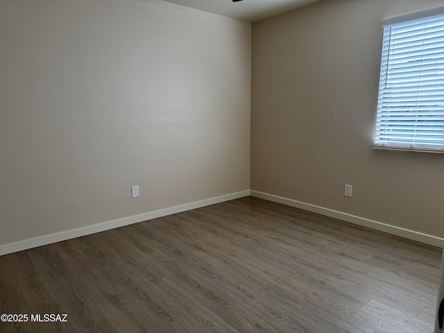 unfurnished room featuring hardwood / wood-style flooring