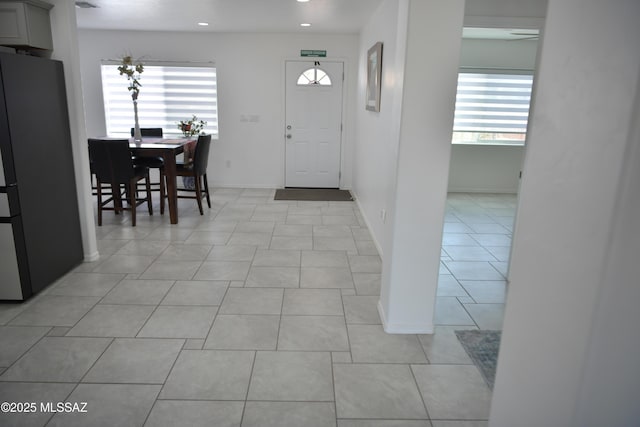 tiled entryway featuring plenty of natural light