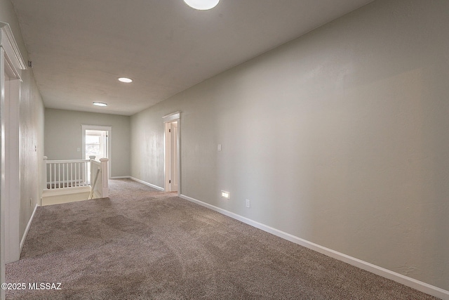 empty room featuring light carpet