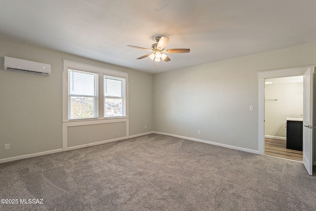carpeted spare room with ceiling fan and a wall mounted AC