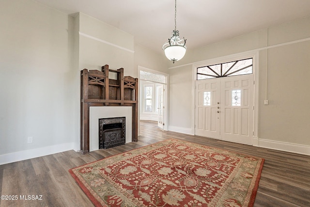 foyer entrance with dark wood-type flooring