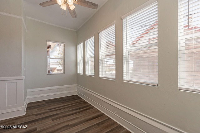 spare room with crown molding, ceiling fan, and dark hardwood / wood-style floors