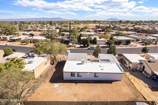 birds eye view of property with a mountain view