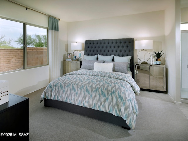 bedroom featuring light colored carpet