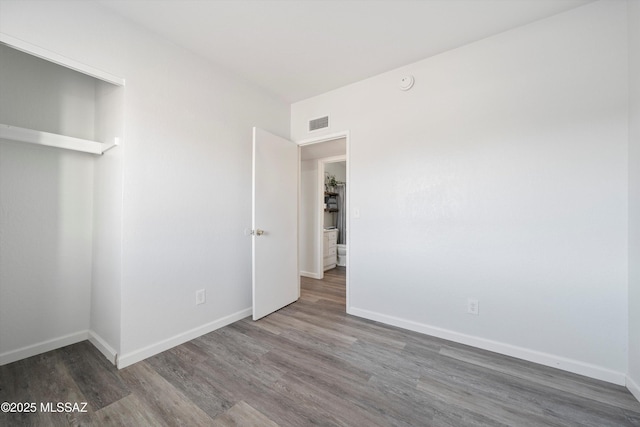 unfurnished bedroom featuring wood-type flooring