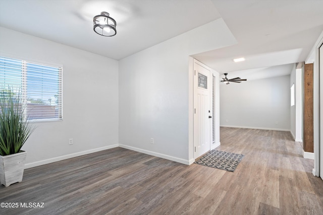 empty room featuring hardwood / wood-style floors and ceiling fan