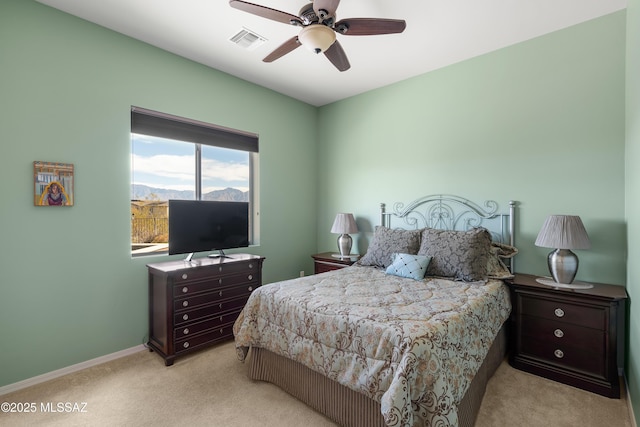 bedroom with light colored carpet and ceiling fan