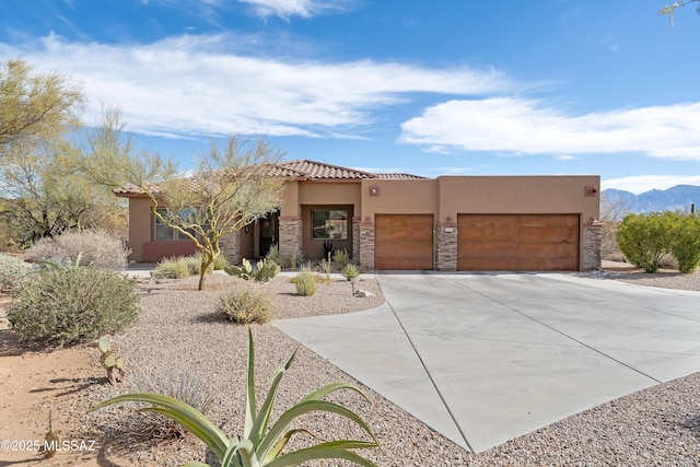 view of front of house with a garage and a mountain view