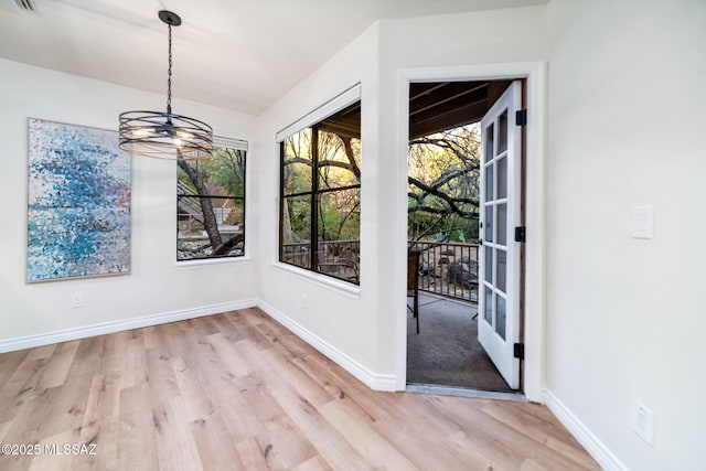 unfurnished dining area featuring light hardwood / wood-style flooring