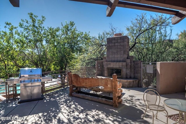 view of patio / terrace with an outdoor stone fireplace