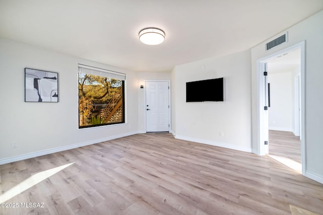 spare room featuring light wood-type flooring