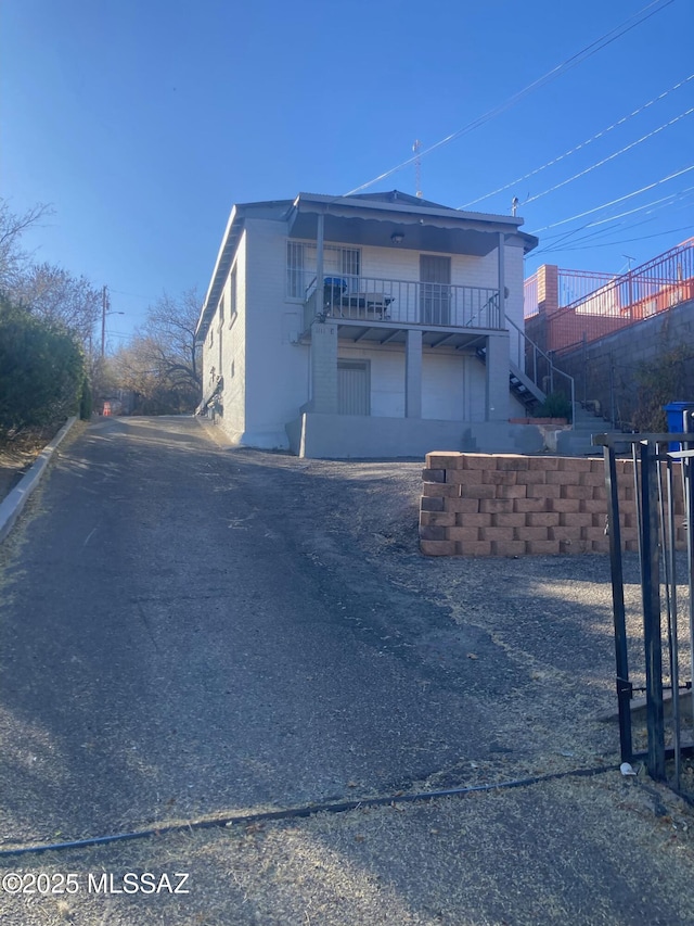 view of front of home with stairs