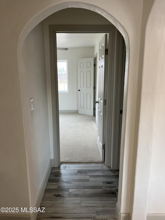 hallway featuring dark wood-type flooring