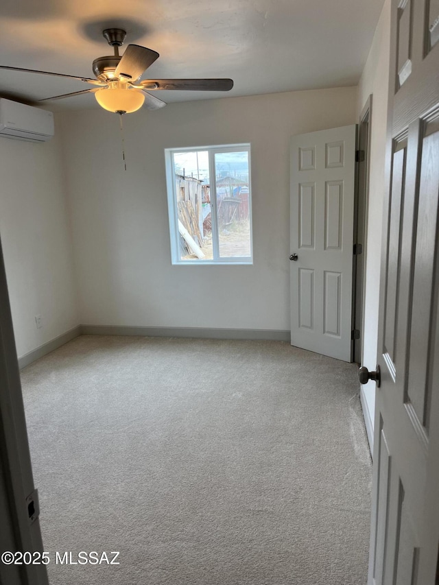 spare room featuring light carpet and an AC wall unit