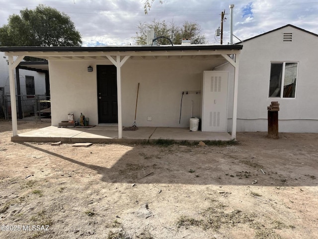 back of property with a patio area