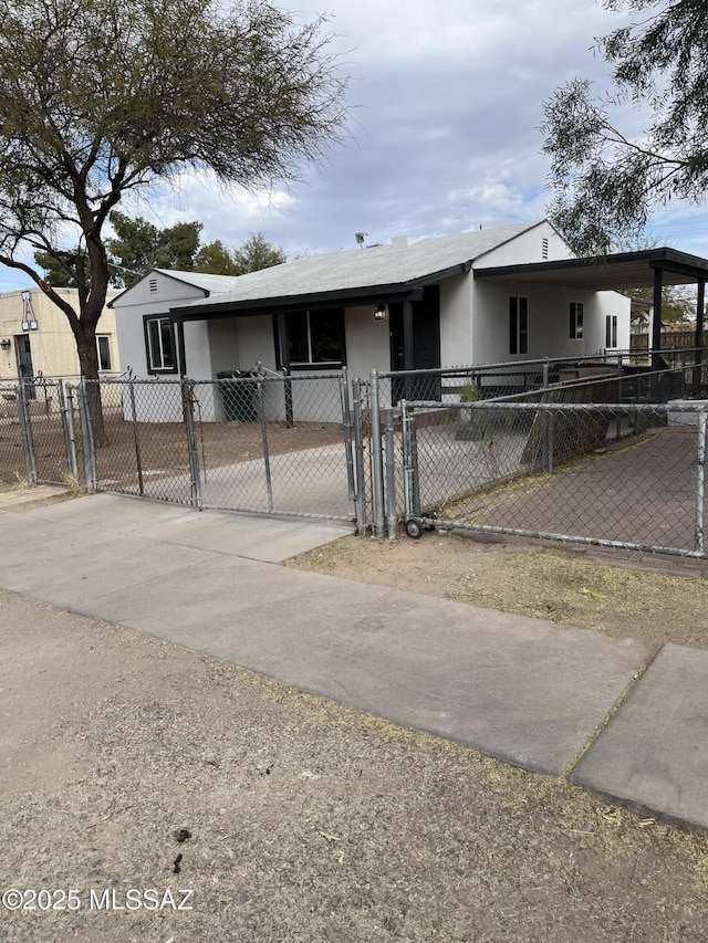 view of front of property featuring a carport