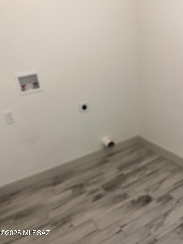 laundry room featuring wood-type flooring and washer hookup