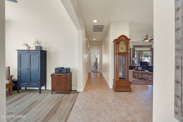 hall with light tile patterned flooring