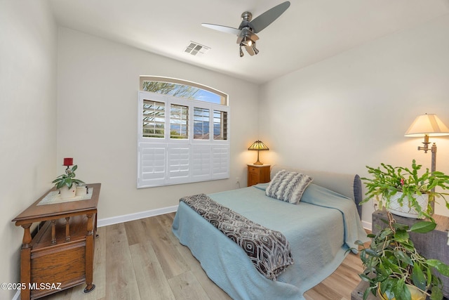 bedroom featuring ceiling fan and light hardwood / wood-style flooring