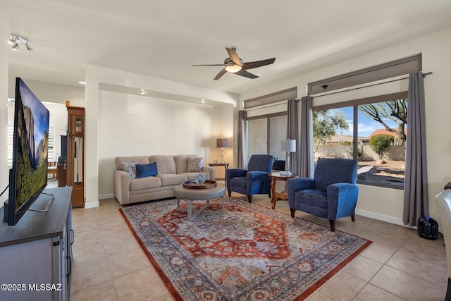 living room with light tile patterned flooring and ceiling fan