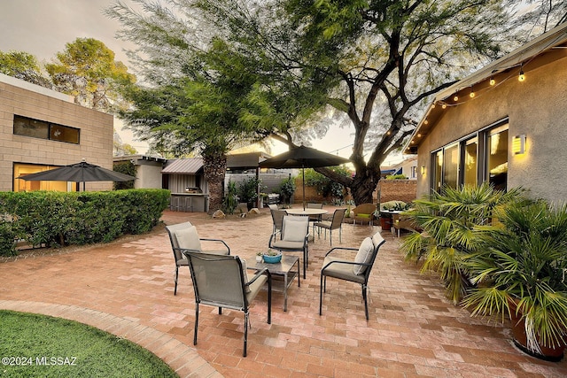 patio terrace at dusk with exterior bar