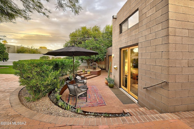 view of patio terrace at dusk