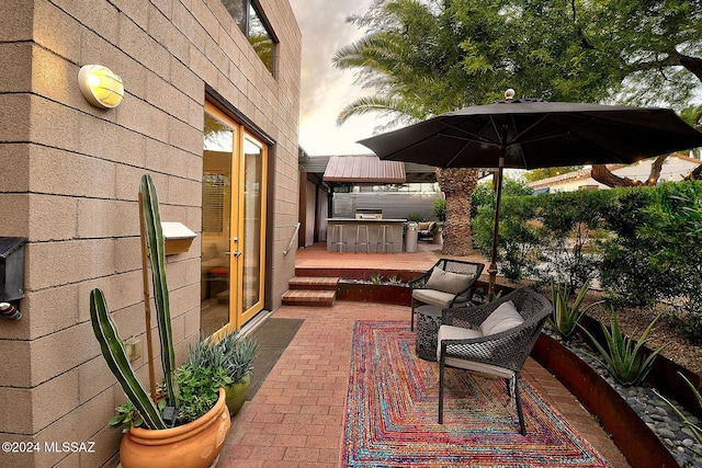 view of patio with an outdoor bar