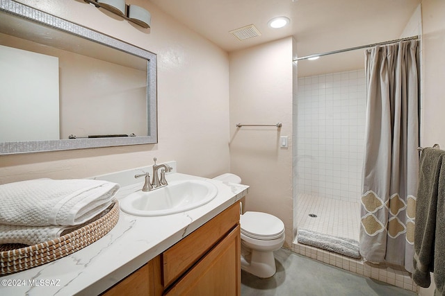 bathroom with toilet, vanity, and a shower with shower curtain