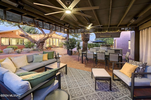 view of patio featuring exterior kitchen, grilling area, outdoor lounge area, and ceiling fan