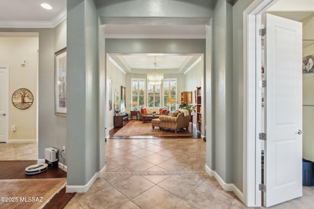 36239 S Cypress Dr, Saddlebrooke, AZ 85739 - entrance foyer with light tile patterned floors, baseboards, crown molding, and an inviting chandelier