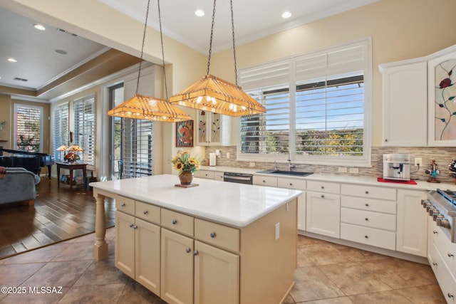 36239 S Cypress Dr, Saddlebrooke, AZ 85739 - kitchen with a sink, ornamental molding, appliances with stainless steel finishes, a wealth of natural light, and tasteful backsplash