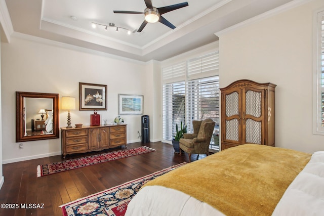 36239 S Cypress Dr, Saddlebrooke, AZ 85739 - bedroom with ornamental molding, a tray ceiling, and hardwood / wood-style floors