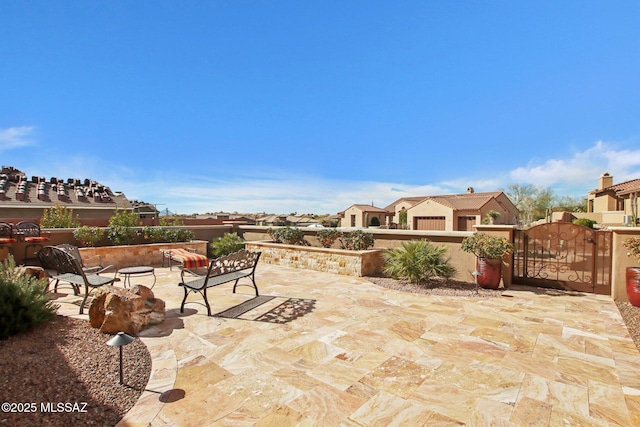 36239 S Cypress Dr, Saddlebrooke, AZ 85739 - view of patio / terrace featuring fence and a gate