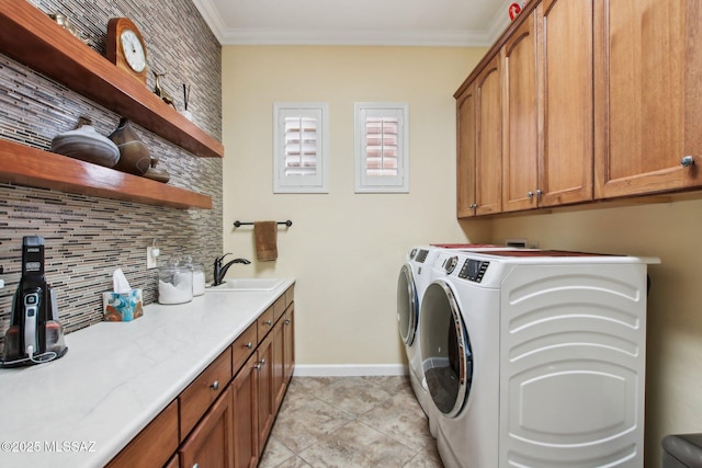 36239 S Cypress Dr, Saddlebrooke, AZ 85739 - washroom with cabinet space, ornamental molding, washing machine and dryer, a sink, and baseboards