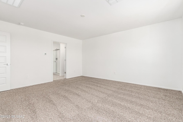 spare room with light colored carpet