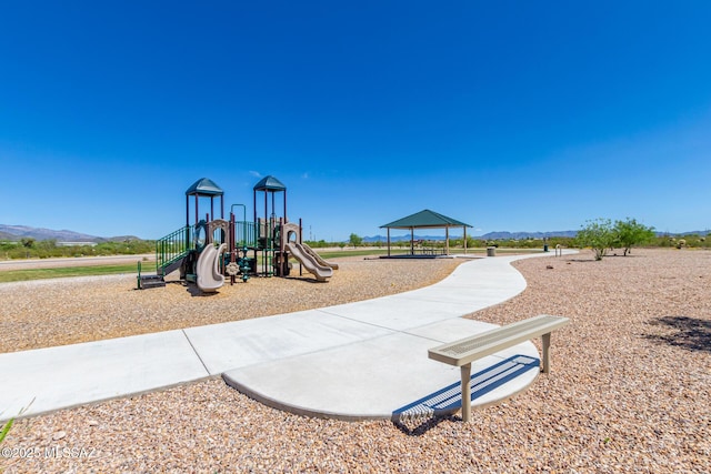 view of playground with a mountain view