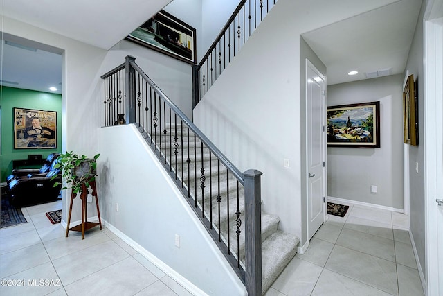 staircase with tile patterned flooring