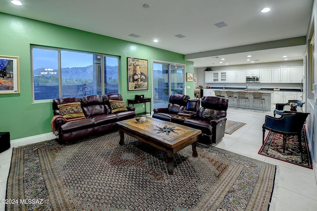 tiled living room with a mountain view