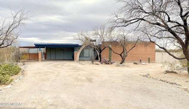 exterior space with a carport