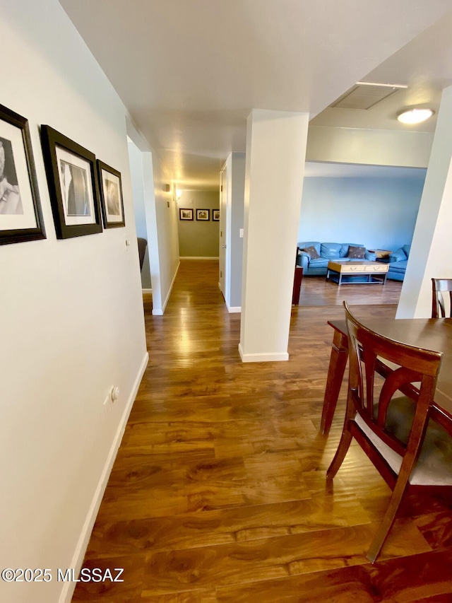 corridor featuring wood-type flooring