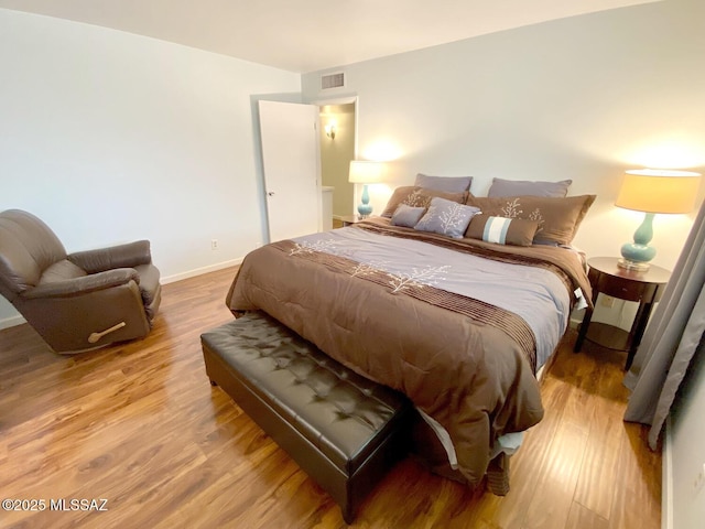 bedroom featuring hardwood / wood-style floors