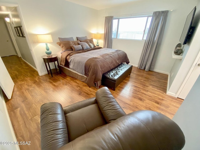 bedroom with light hardwood / wood-style floors