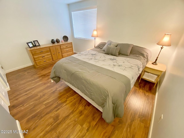 bedroom featuring dark hardwood / wood-style floors