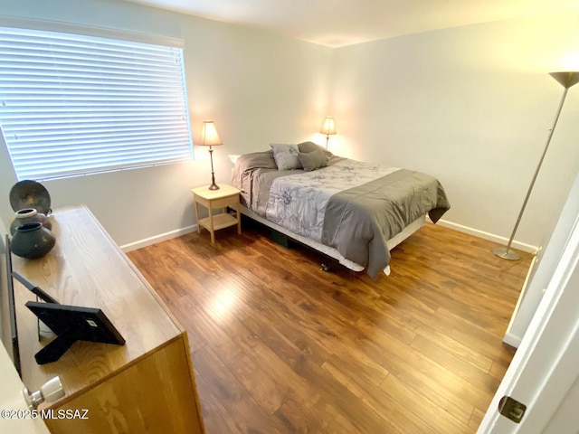 bedroom featuring wood-type flooring