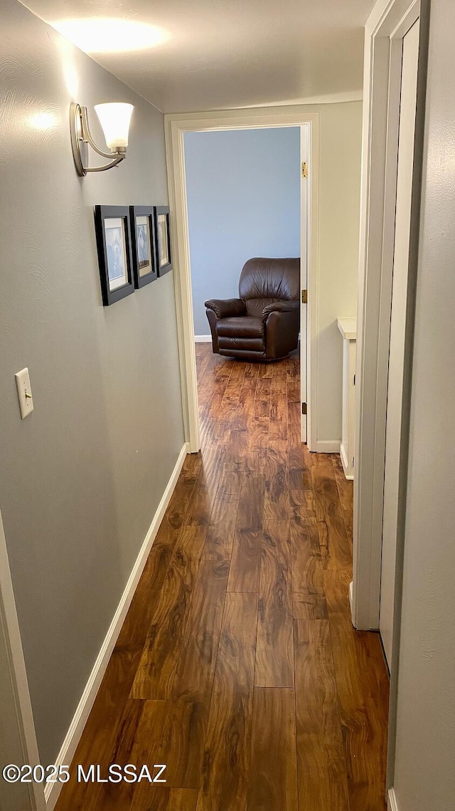 hall with dark hardwood / wood-style floors