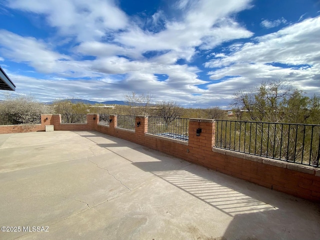 view of patio / terrace featuring a mountain view